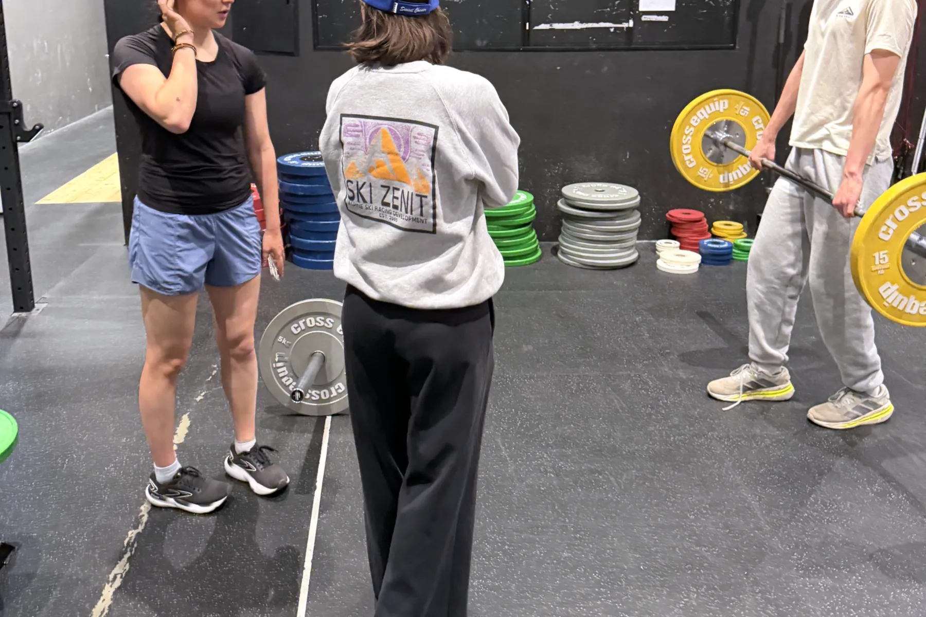Coach supervising strength training for ski racers